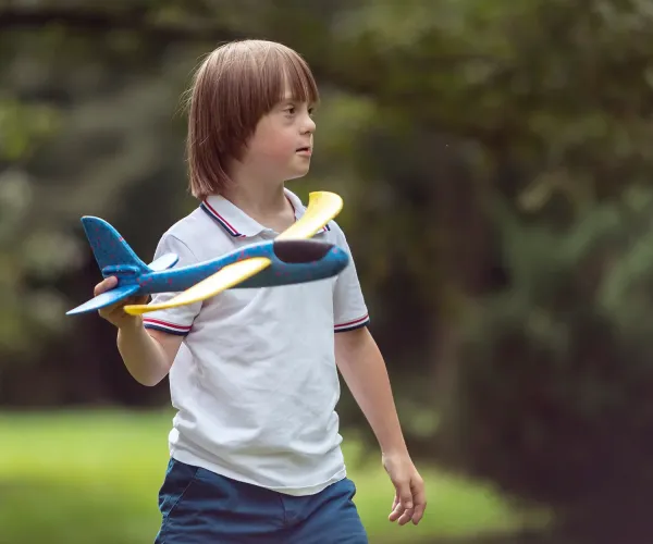 Child playing with airplane